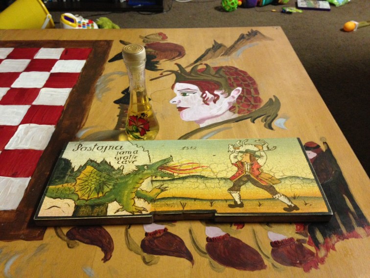 Souvenirs from Slovenia. The beehive cover shows a farmer sacrificing a sheep to the Ljubljana dragon. 